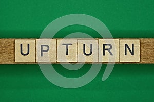 Gray word upturn from small wooden letters photo