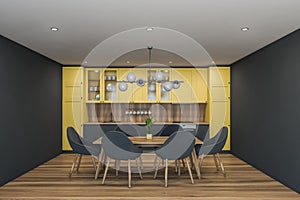 Gray and yellow kitchen interior with table