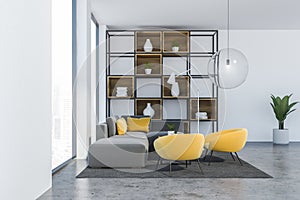 Gray and yellow loft living room with bookcase