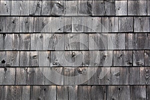 Graying unstained wood shingles weathered with age