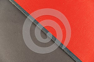A grayish-red abstract background. Rectangle diagonally divided into two multicolored zones photo