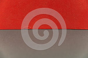 A grayish-red abstract background. Rectangle horizontally divided into two multicolored zones photo