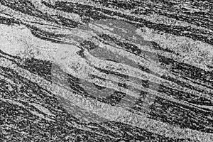 Grayscale closeup shot of a patterned rough constructional surface for background