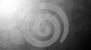 A grayscale image with a textured surface and subtle gradient effect