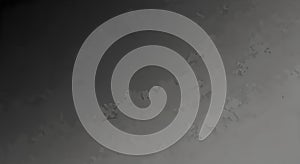 A grayscale image with a subtle gradient effect and faint diagonal lines