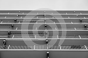 Grayscale low angle shot of a modern balcony building