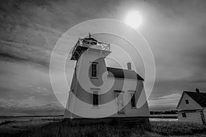 Grayscale of the North Rustico Harbour Light in New Glasgow, Prince Edward Island photo