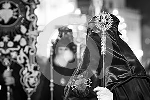 Grayscale of the Semana Santa procession in a church in Spain photo