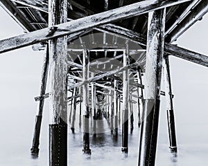 Grayscale shot of the balboa pier on Newport Beach, CA