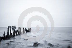 Grayscale shot of a beautiful seascape under a cloudy sky in Ostsee, Germany