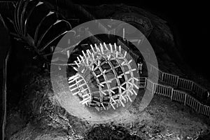 Grayscale shot of equipment in a salt mine in Turda, Romania