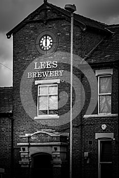 Grayscale shot of the Lees Brewery at daytime in Middleton, United Kingdom