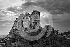 Grayscale shot of the Mow Cop Castle under a cloudy sky in England, the UK