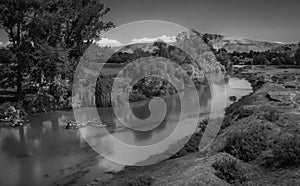 Grayscale shot of Pineios river in Greece