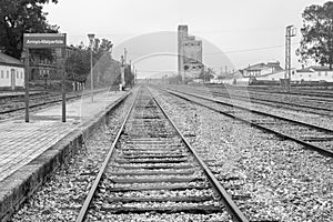 Grayscale shot of railroad tracks at Arroyo Malpartida train station in Extremadura, Spain
