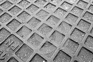 Grayscale shot of a texture of a geometric concrete surface