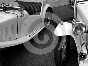 Grayscale shot of a white French classic limousine as a wedding car