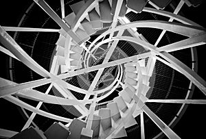 Grayscale spiral staircase symmetry on a black background