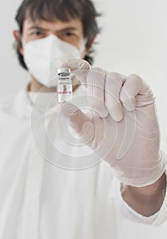 Graz,Austria-26.01.2021: Doctor holding a vaccine bottle and syringe, beginning of mass vaccination with the Moderna COVID-19