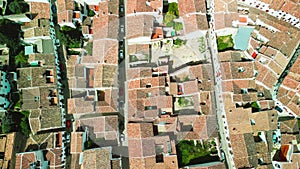 Grazalema, Andalusia. Aerial view of whitewashed houses sporting rust-tiled roofs and wrought-iron window bars