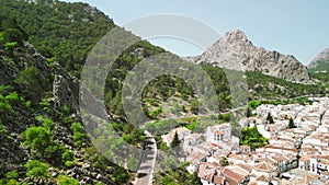 Grazalema, Andalusia. Aerial view of whitewashed houses sporting rust-tiled roofs and wrought-iron window bars