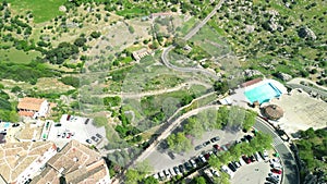 Grazalema, Andalusia. Aerial view of whitewashed houses sporting rust-tiled roofs and wrought-iron window bars