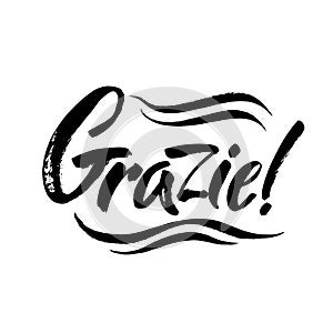 Grazie - thank you in Italian. Calligraphy inscription, black word on white background. Handwritten note