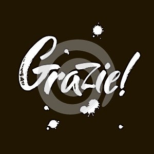 Grazie - thank you in Italian. Calligraphy inscription, white word on black background. Handwritten note. Vector