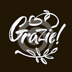 Grazie - thank you in Italian. Calligraphy inscription, white word on black background. Handwritten note. Vector