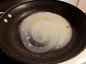 grease or fat in frying pan or skillet on stove