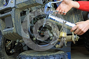 A Grease Gun Used On A Quad Bike