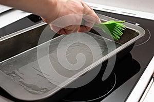 Greasing baking sheet with oil