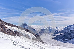 Great Aletsch glacier and Bernese Alps and jungfrau snow mountain peak  with blue sky background view from Jungfraujoch top of
