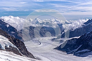 Great Aletsch glacier and Bernese Alps and jungfrau snow mountain peak  with blue sky background view from Jungfraujoch top of