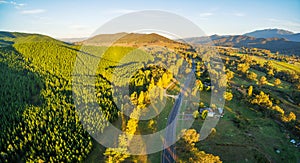 Great Alpine Road passing through Australian countryside at suns