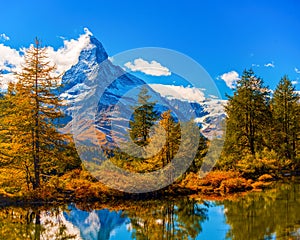Great autumn scenery with famous peak Matterhorn reflected in Grinjisee lake. Swiss Alps, Valais, Switzerland