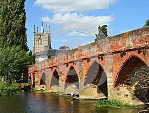 Great  Barford  Packhorse Bridge and All Saints Church  Tower. Bedfordshire England.