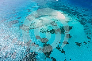 Great Barrier Reef and coral sand cay from above photo