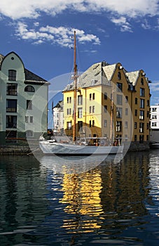 Great boat and house reflected - Alesund, Norway