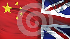 Great Britain and China politicians exchanging top secret envelope against flags