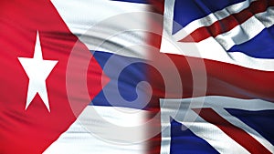 Great Britain and Cuba politicians exchanging top secret envelopes against flags