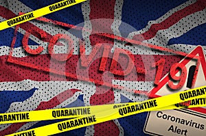 Great britain flag and Covid-19 quarantine yellow tape with red stamp. Coronavirus or 2019-nCov virus