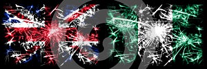 Great Britain, United Kingdom vs Nigeria, Nigerian New Year celebration travel sparkling fireworks flags concept background.