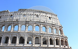 Great Colosseum in Rome, Italy, Europe. Roman Coliseum close-up with clear blue sky.