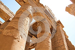 The great columns with carved hieroglyphs at the Karnak temple,  Thebes of Egypt in Luxor