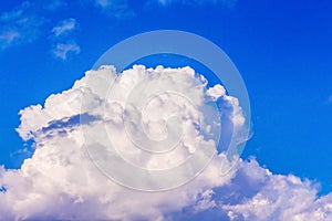Great curly cloud on a blue sky. The sky with a cloud on clear,