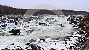Great falls winter white water waterfall with snowy rocks - wide shot - Great Falls National Park