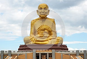 The Great Golden statue Monk at Puttha Utthayan Maharat Buddha Park