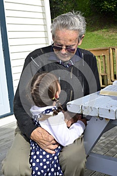 Great Granddad hug his great grandchild photo