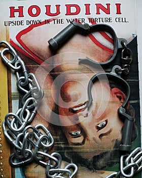 Great Houdini torture cell poster with handcuffs and chains